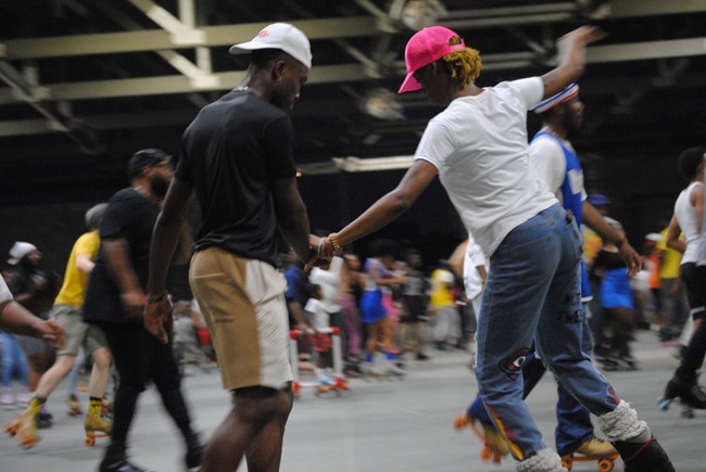 Two people skate in the Anacostia Skating Pavilion