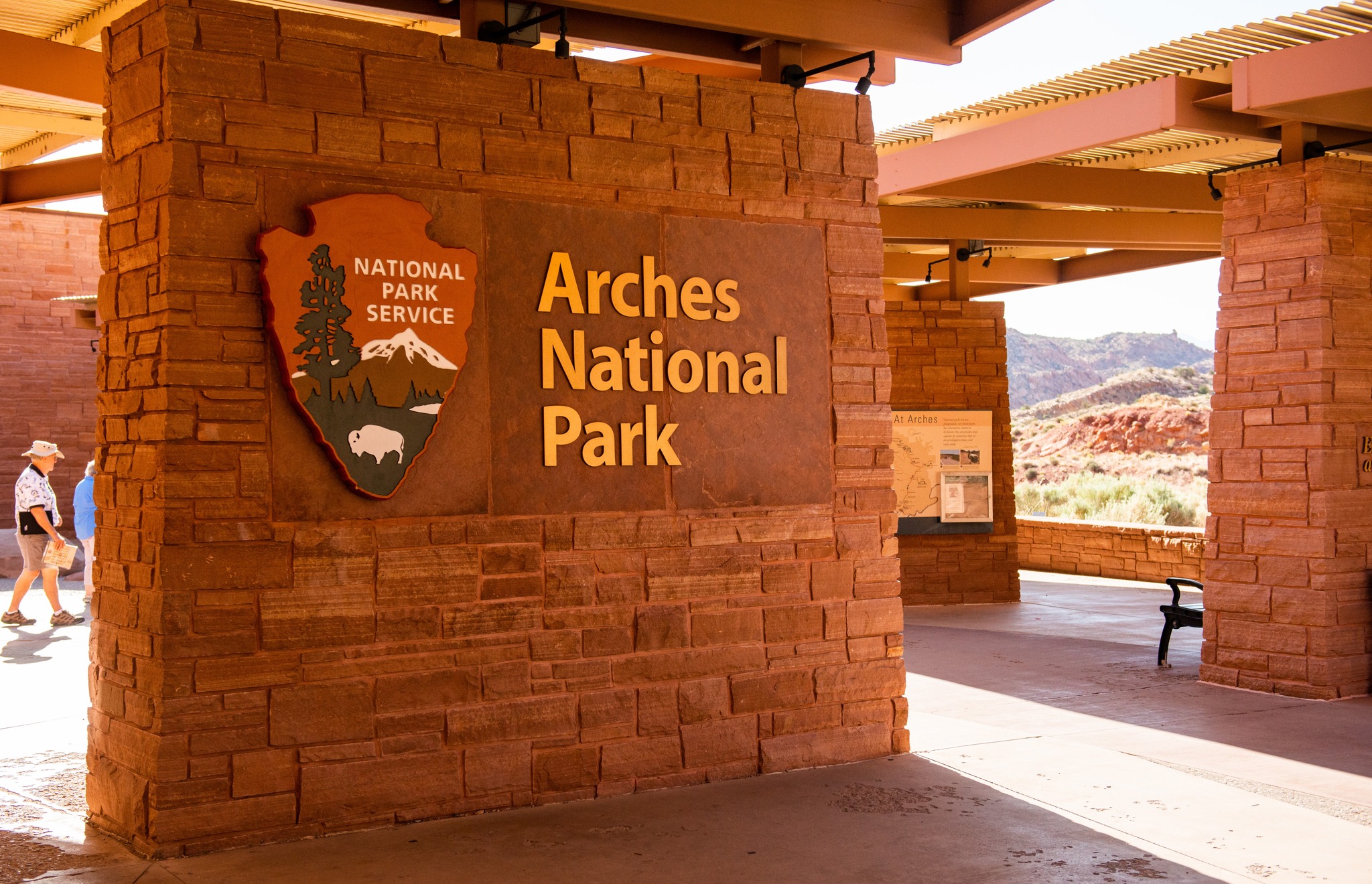 Sunlight streams through the Arches Visitor Center Plaza