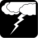 A group of clouds with a lightning bold coming out of them.