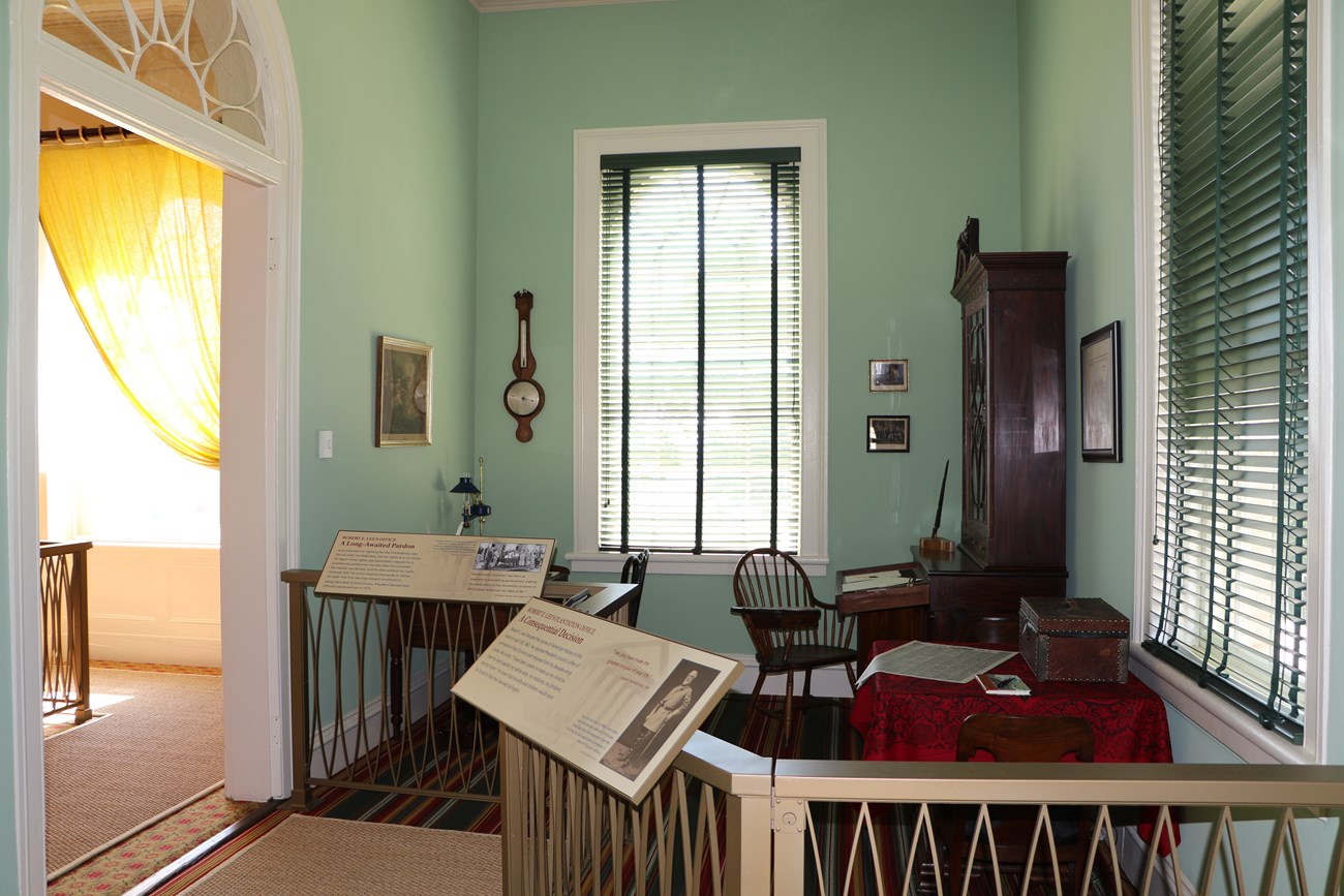 A green room with desks.