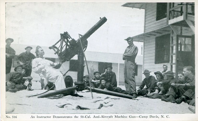 A postcard showing the demonstration of a 50-caliber anti-aircraft machine gun at Camp Davis. A postcard showing the demonstration of a 50-caliber anti-aircraft machine gun at Camp Davis.