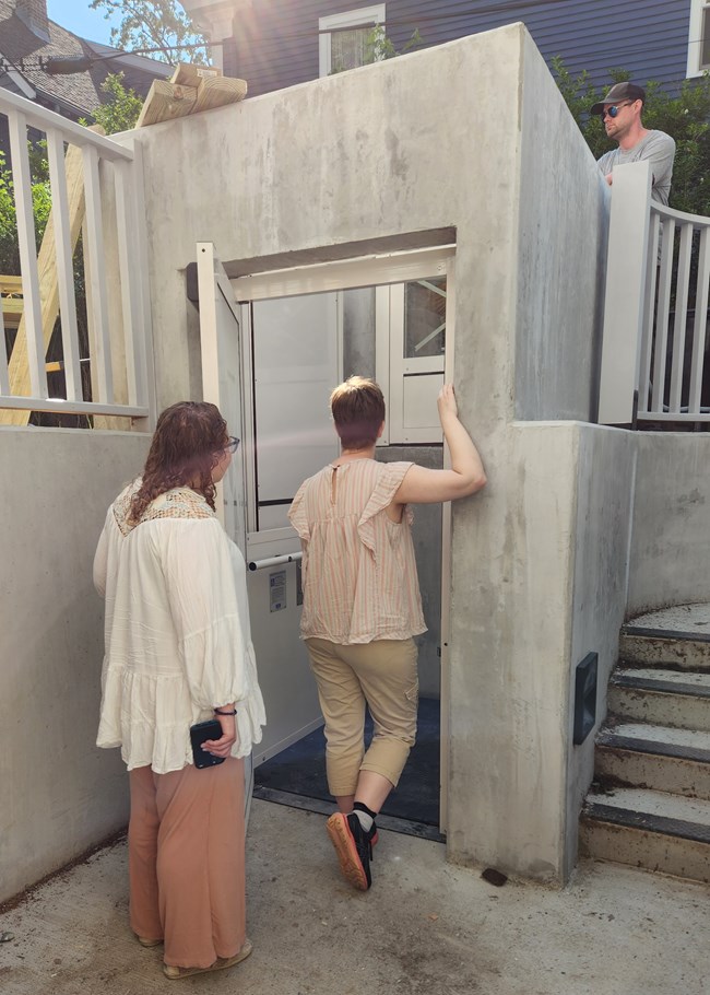 Staff view the new lift