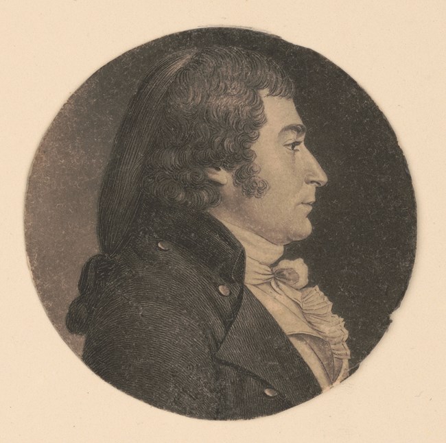 A head-and-shoulders portrait, right profile, in black and white.