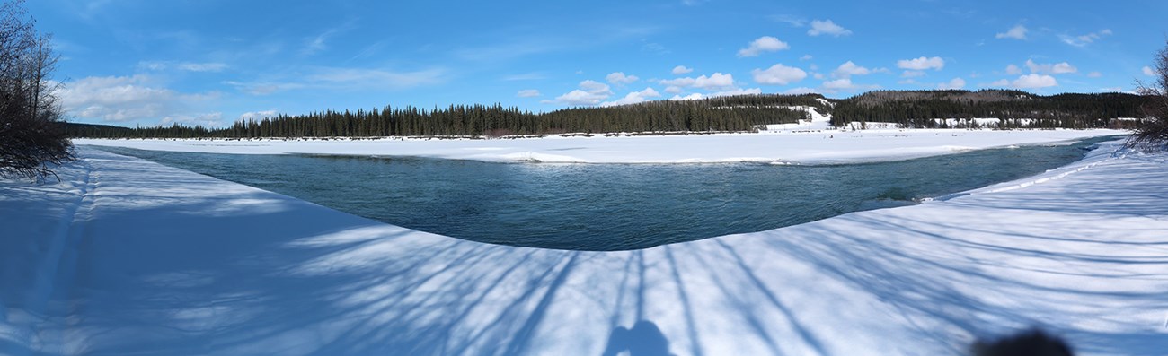 Open water on a river on a clear winter day.