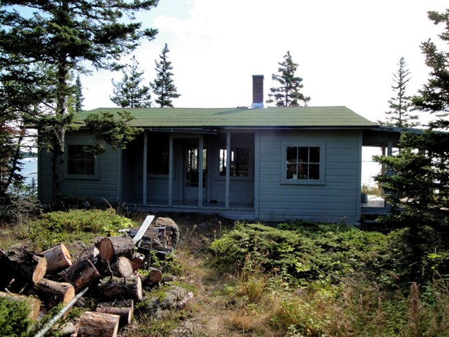 long rectangular cabin with covered front porch