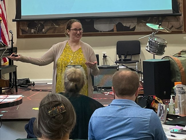 woman lecturing to a group