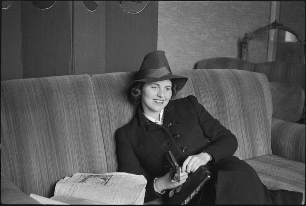 KFC-01052N Rosemary reclines on a couch.
