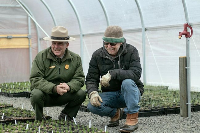 JODA Superintendent and East Cascades Native Plant Hub co-director looking over young native sagebrush steppe plants during East Cascades Native Plant Hub Wintercreek Nursery tour