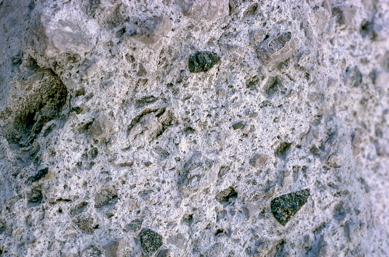 a1c32eae-5e81-4a8b-8095-03a73035e24bOriginal Photo of volcanic rock close-up showing fine- and course-grained materials "welded" together.