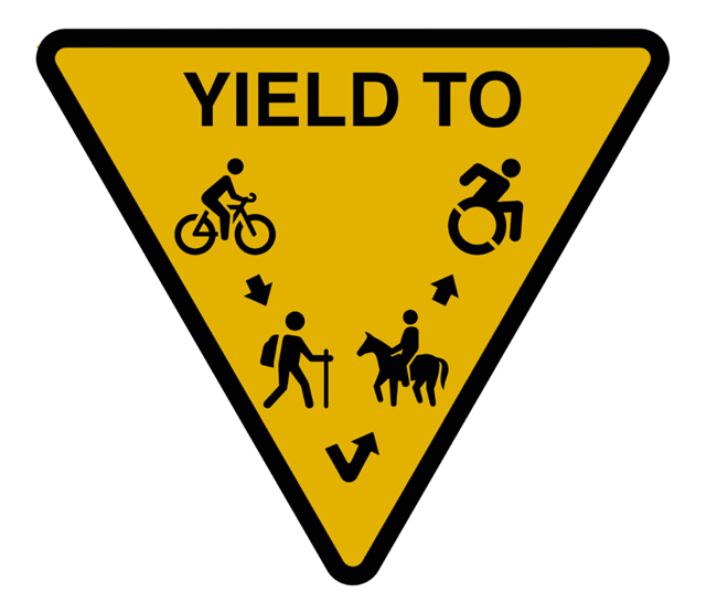 yield-triangle a yellow yield triangle for multiuse trails that shows that bikes yield to hikers and stock and hikers yield to stock.