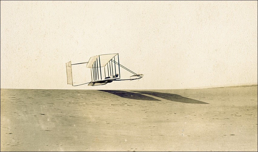 Photo of Orville Wright flying the 1902 glider. Photo of Orville Wright flying the 1902 glider.