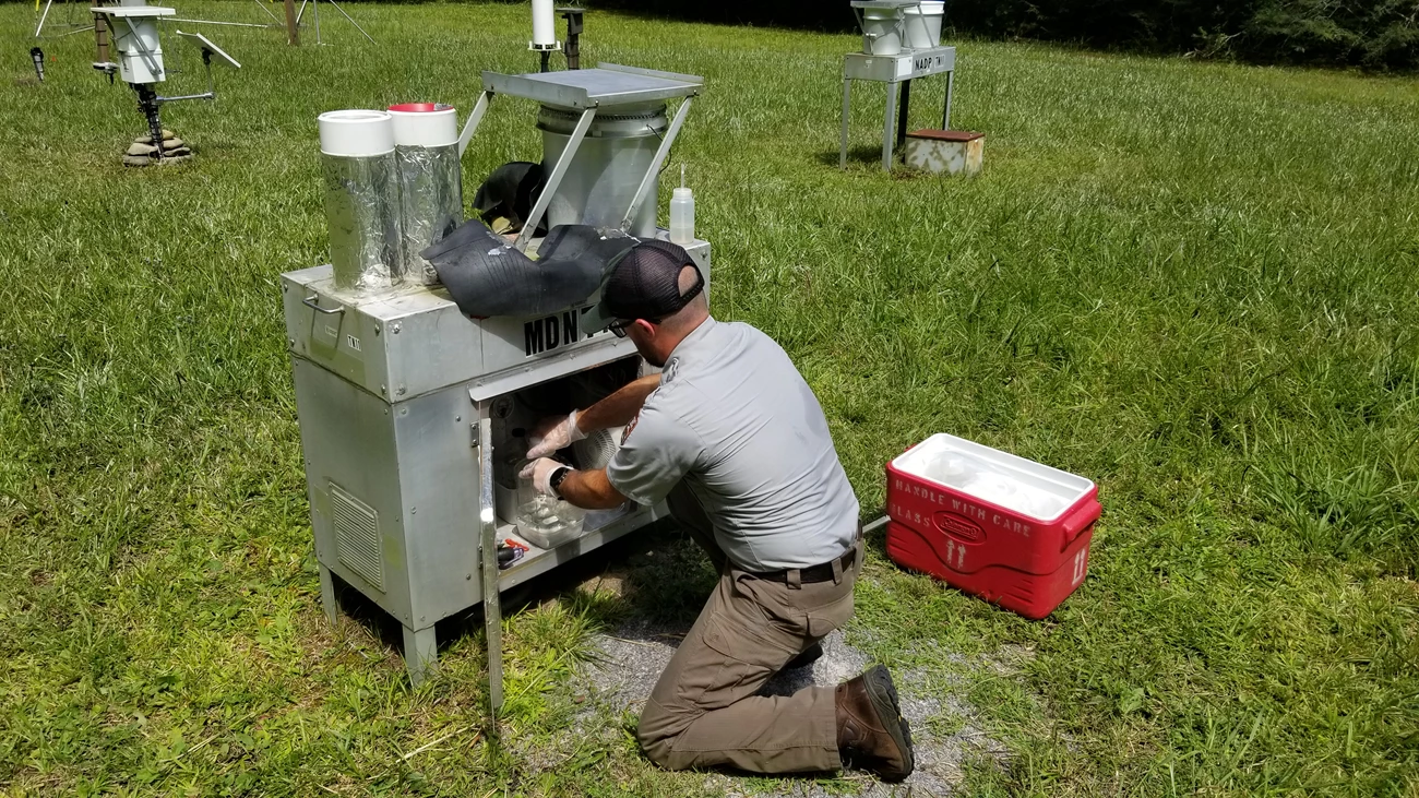 Wet mercury deposition collector National Park Service staff collects water from a wet mercury deposition collector.