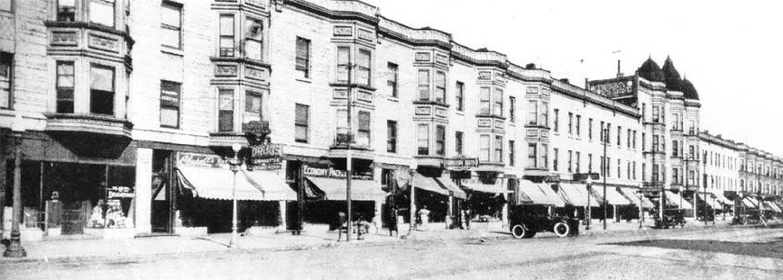 Photo of State Street in Chicago with brick houses, 1925. (The Negro in Chicago, 1779-1929, Washington Intercollegiate Club of Chicago, Inc., 1929.) Photo of State Street in Chicago with brick houses, 1925. (The Negro in Chicago, 1779-1929, Washington Intercollegiate Club of Chicago, Inc., 1929.)