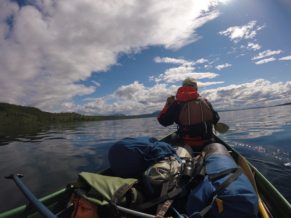 Person canoeing on a lake