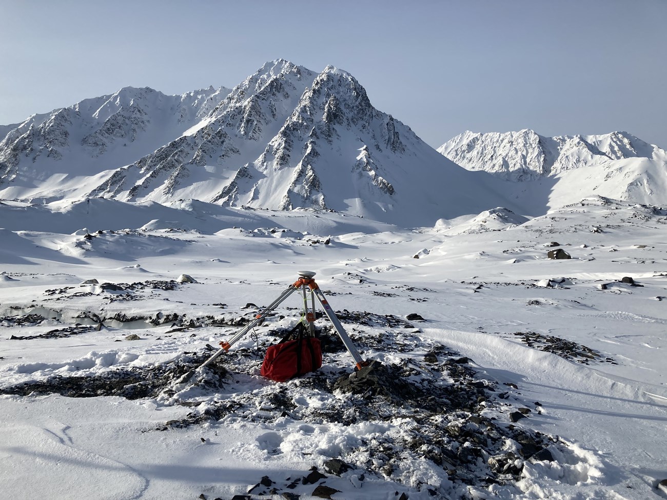 a camera perched amid snow and rocks