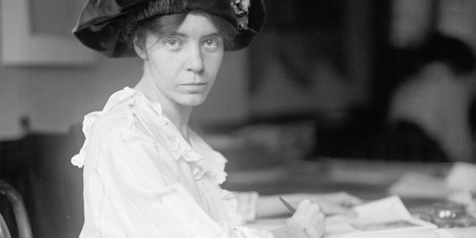 Black and white photo of Alice Paul, a young woman in a hat. Black and white photo of Alice Paul, a young woman in a hat.