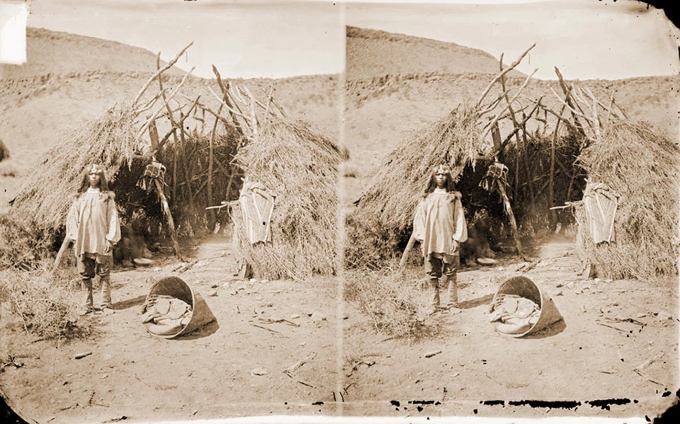 Southern Paiute boy by wikiup shelter Southern Paiute boy by wikiup shelter