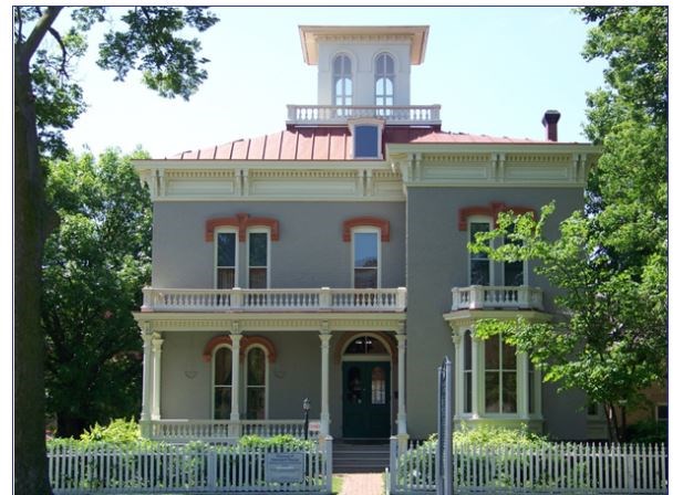 Photo of two story house with terrace.