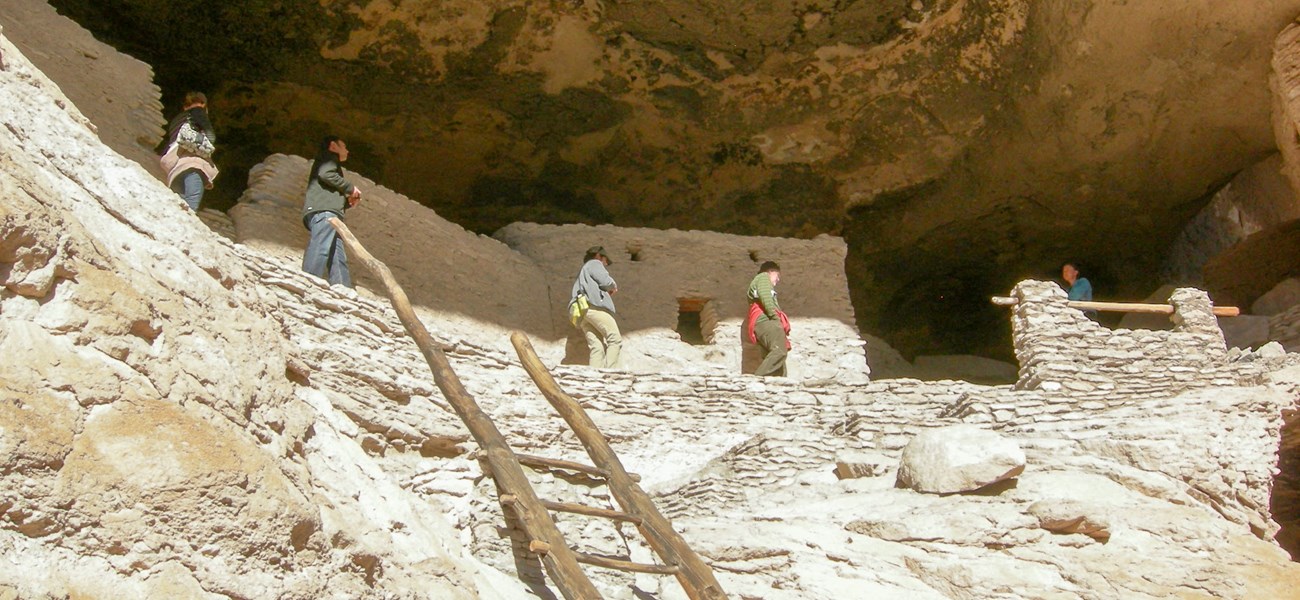 Visitors explore Gila Cliff Dwellings