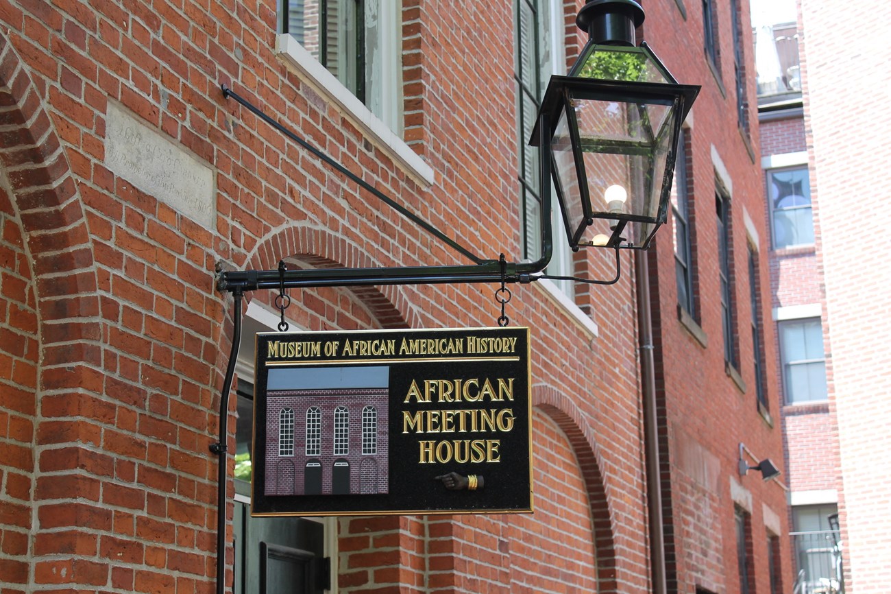 Close-up of sign for a brick building - the Museum of African American History.