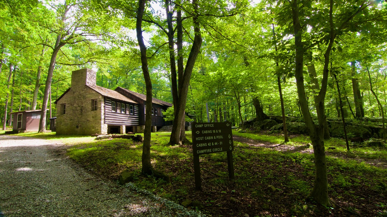 Large log structure at the top of a wooded hill