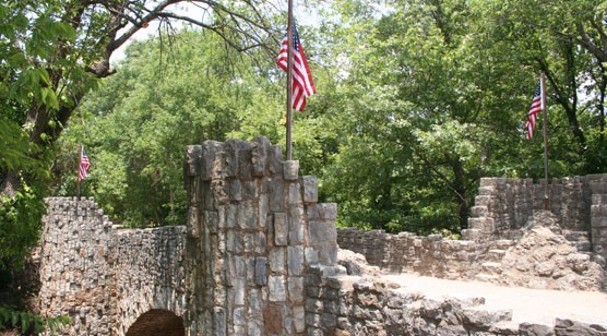 4 US flags flying over Lincoln Bridge