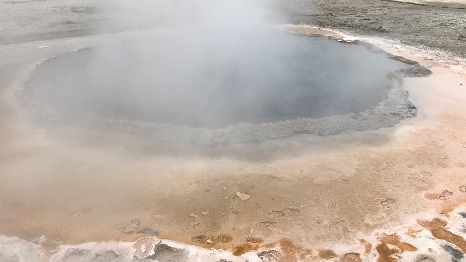 Infrared scene shows the hot water of the hot spring (in yellow) in contrast the the surrounding cool landscape (in blue)