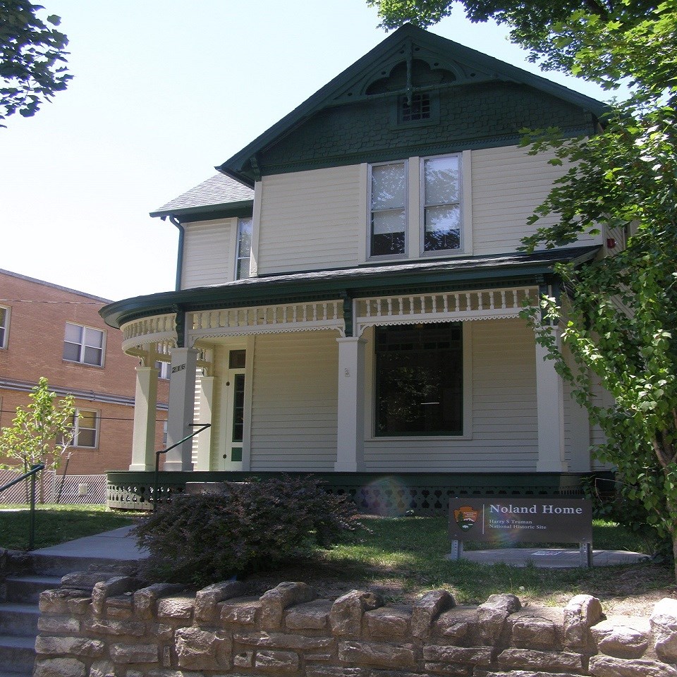 Victorian house, President Harry S Truman descending stone steps in front