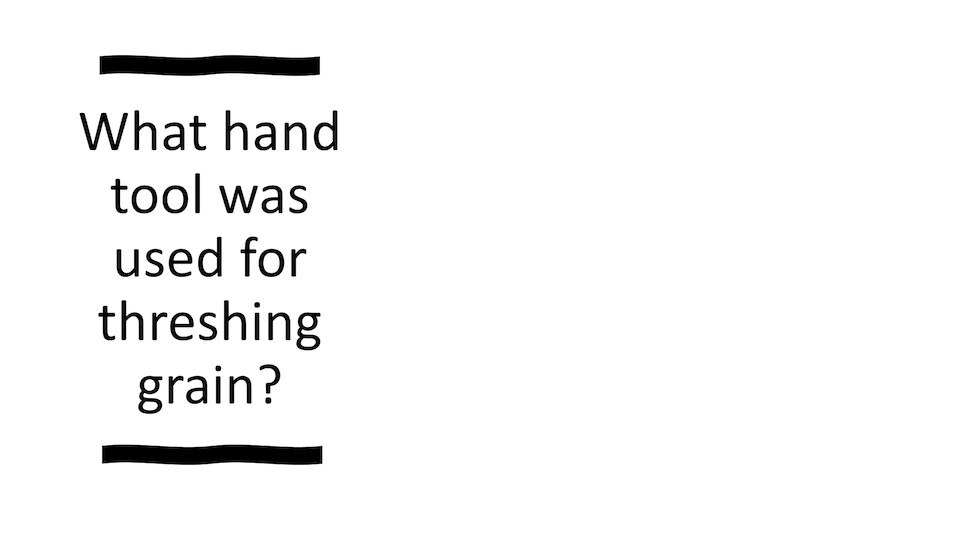 What hand tool was used for threshing grain?