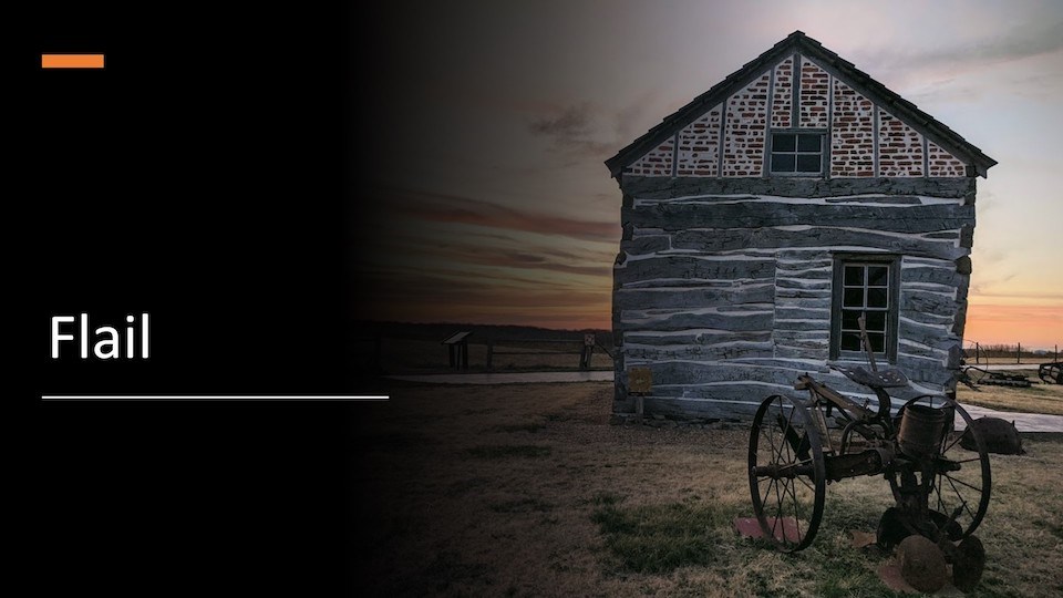 What hand tool was used for threshing grain?