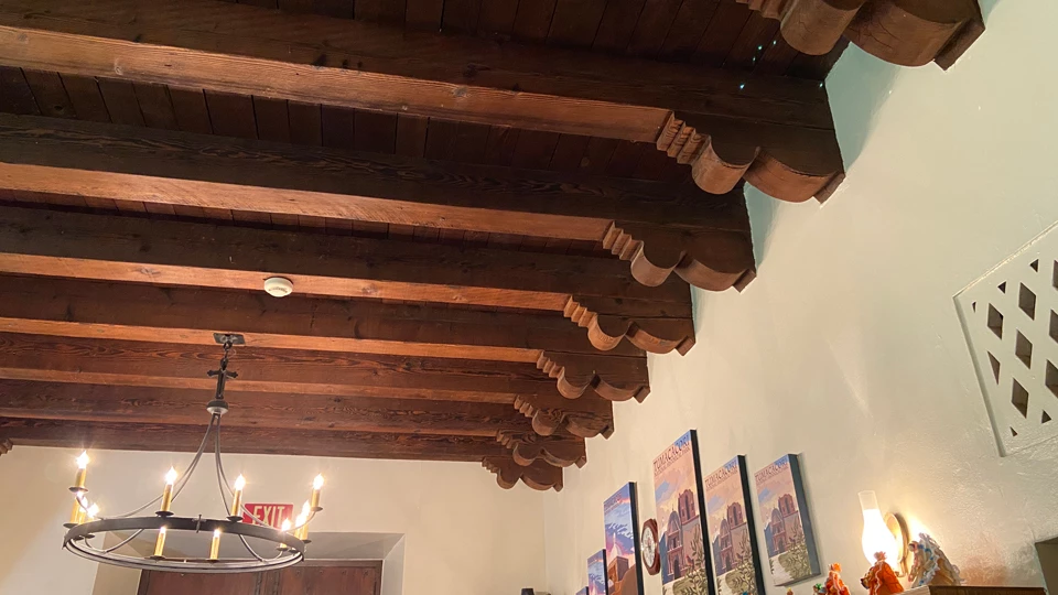 historic photo of roof beams with carved corbels