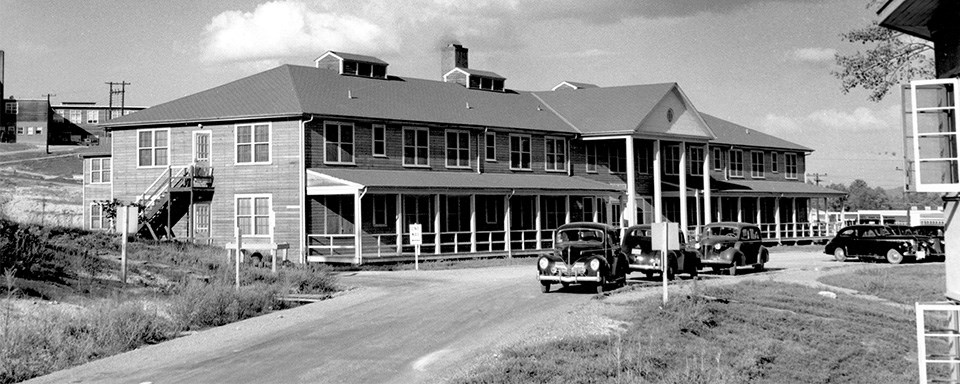 A black and white image of a building with many windows.