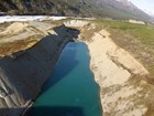 rectangular, blue tailings pond