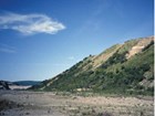 shrub covered bluff next to a valley