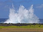 spray from wave crashing into coastal bluff