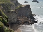 rock fall debris on narrow beach