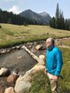 Tom Henderson stands near Soda Butte Creek