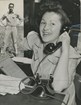 Black and white photo of a woman on the phone
