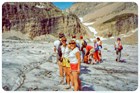 a crowd of people standing on a glacier