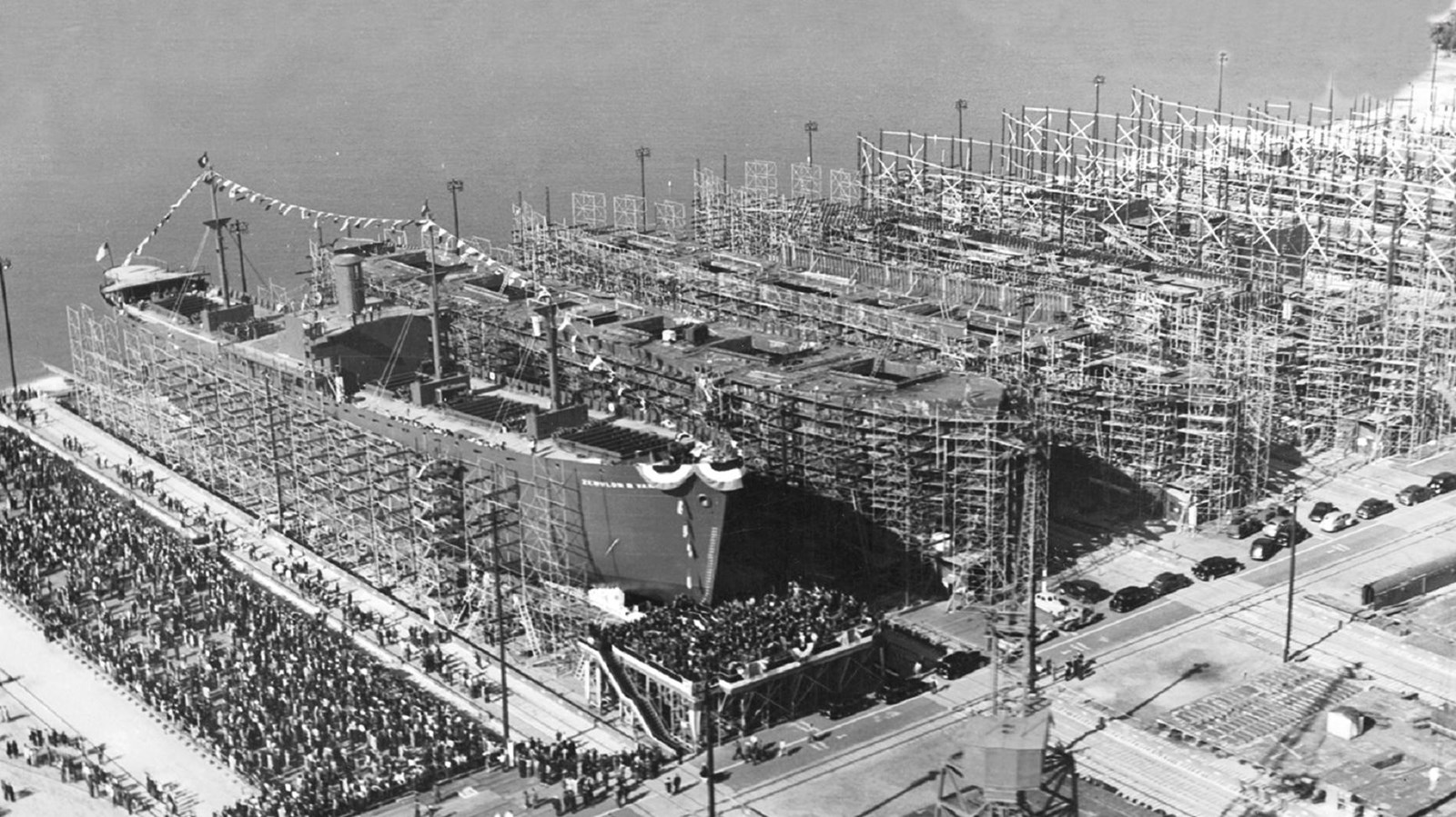 Row of large ships with scaffolding