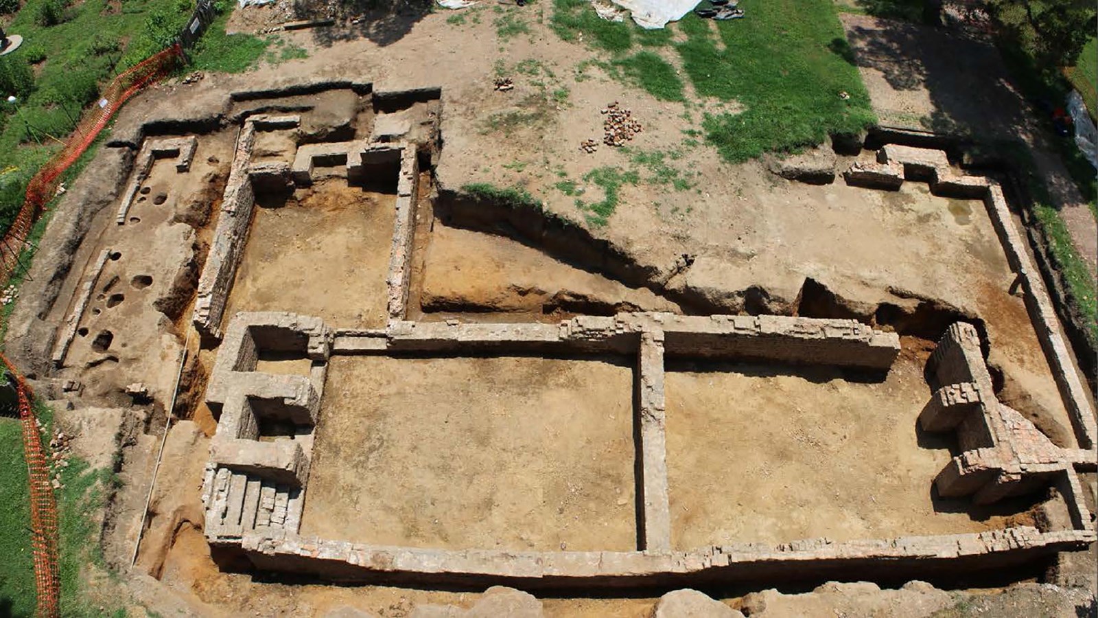 Top-down view of an excavated brick foundation.