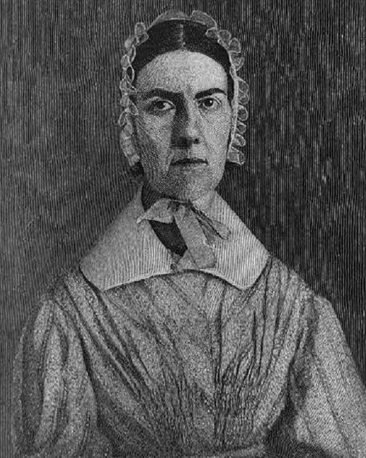 a woman wearing a bonnet and a 1800s dress