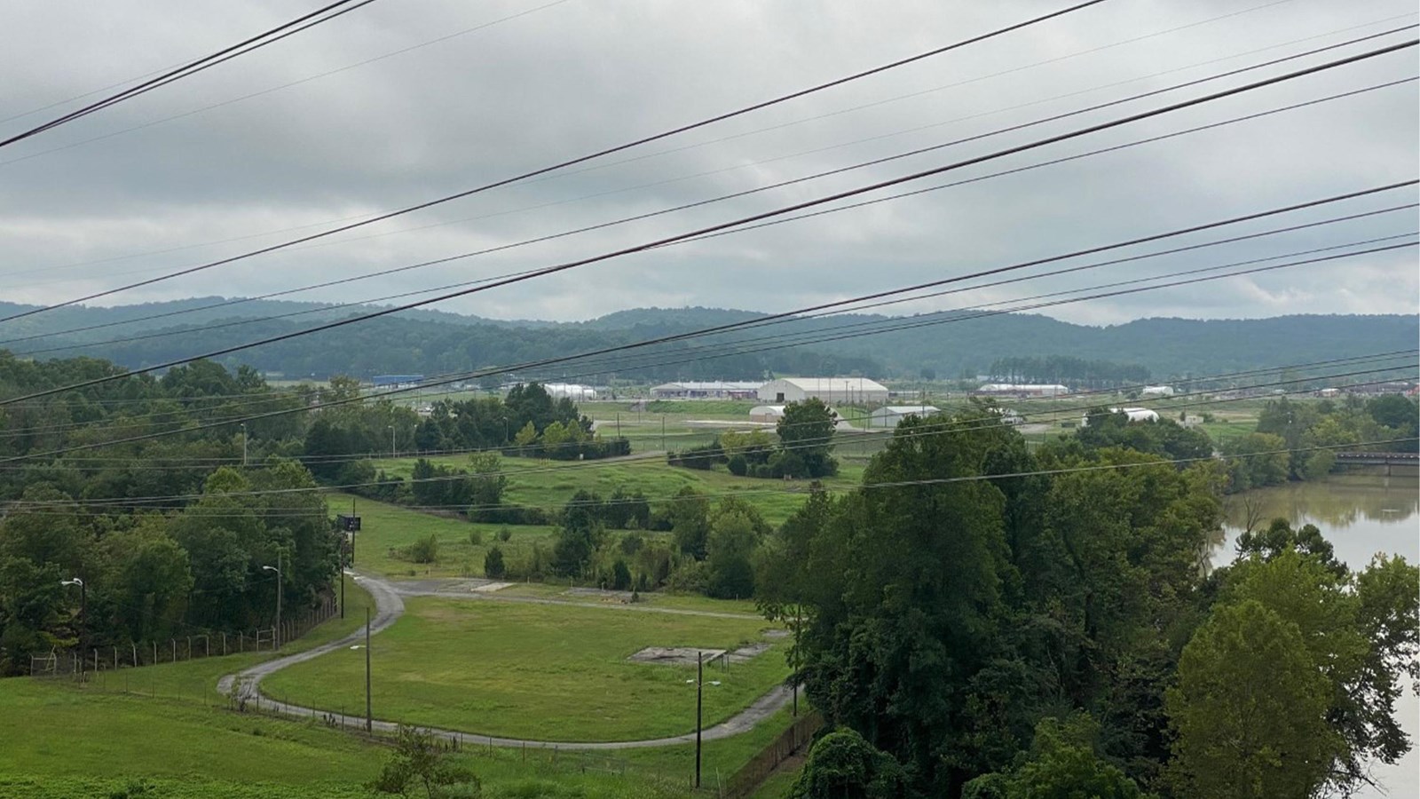 Overlook view of large valley with scattered structures