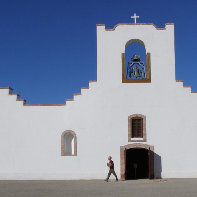 White Spanish mission against bright blue sky