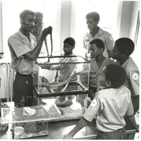 Ranger Mac showing Junior Rangers a snake