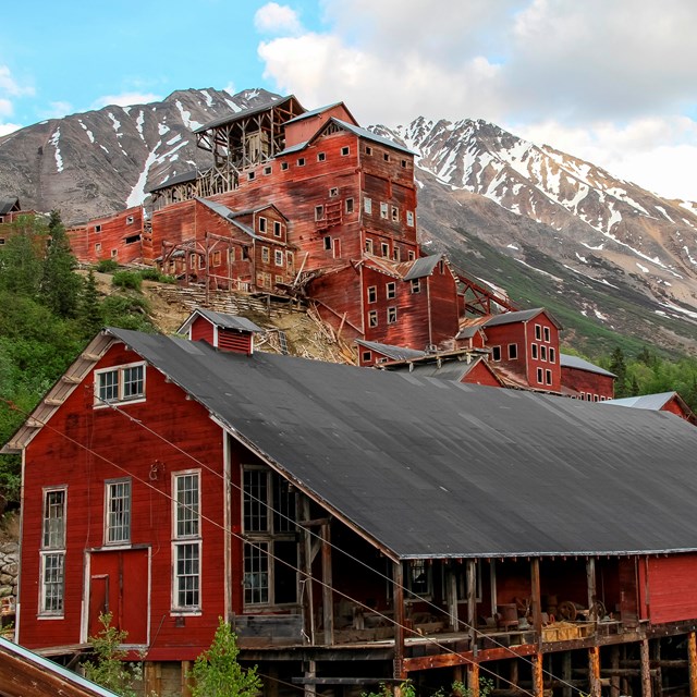 Red buildings with mountains in the distance