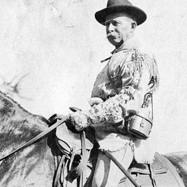 Man on horseback, black and white photo