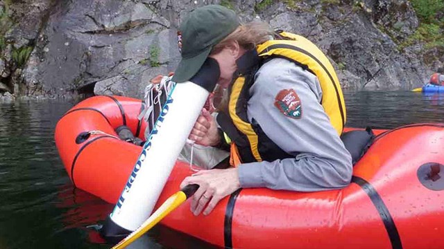 A researcher scans for invasive aquatic plants.