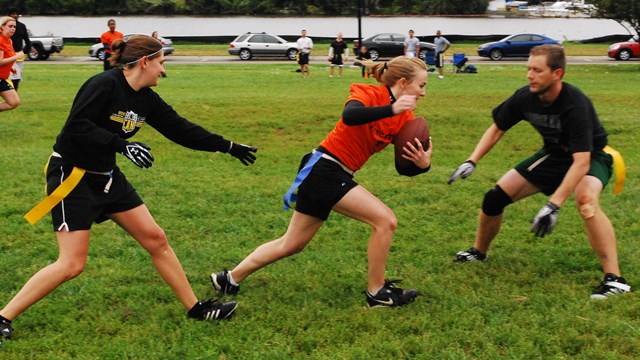 A group plays flag football