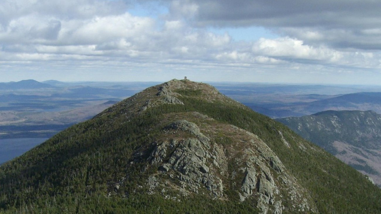 An overlook along the A.T. overlooking a mountain range in the distance.